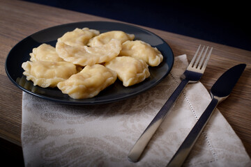 Dumplings with meat cherries vegetables cabbage pork turkey beef. A traditional Russian dish. Delicious and healthy breakfast.