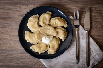 Dumplings with meat cherries vegetables cabbage pork turkey beef. A traditional Russian dish. Delicious and healthy breakfast.