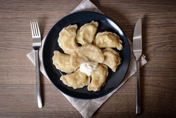 Dumplings with meat cherries vegetables cabbage pork turkey beef. A traditional Russian dish. Delicious and healthy breakfast.
