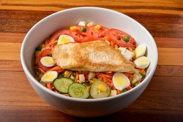 Grilled chicken breast and salad greens..Brazilian healthy food.