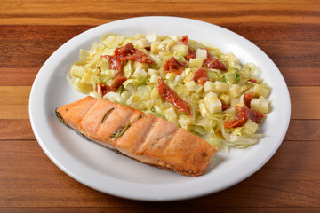 Grilled salmon and salad greens..Brazilian healthy food.