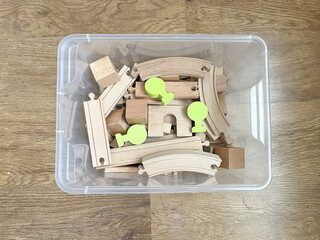 Wooden toys in a box. The concept of childhood and child development. Montessori. Environmentally friendly material. A large number of toys.