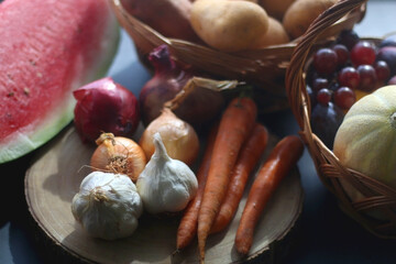 Various seasonal fruit and vegetable on dark background. Selective focus.