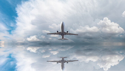 White passenger airplane over the stormy dark clouds  - Travel by air transport