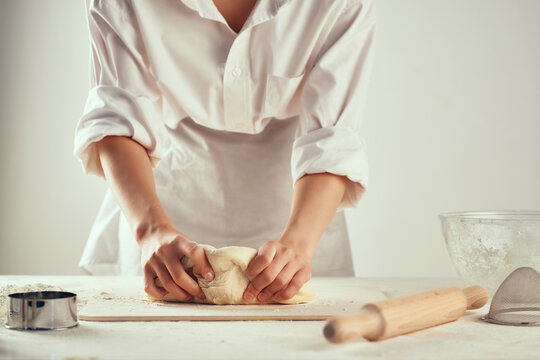 kneading dough in the kitchen rolling pin baking homework