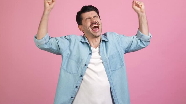 Crazy astonished funny man celebrate lucky bet victory