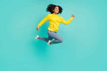 Fototapeta na wymiar Full length body size view of pretty active cheerful girl jumping running isolated over bright teal turquoise color background