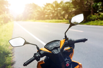 Yellow Scooter bike on an empty sunny road © agacat