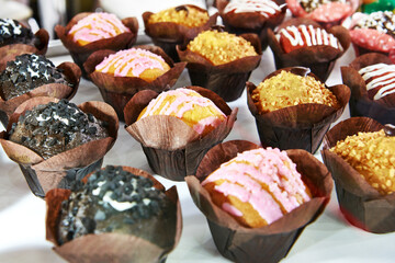 Assorted cupcakes on shop
