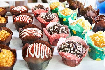 Assorted cupcakes on shop