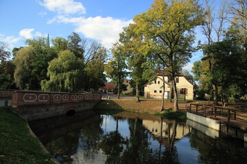 Fototapeta na wymiar Beautiful autumn European city landscape with reflection, Kuldiga, Latvia. High quality photo