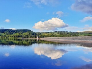 Water and sky landscape over a body of water in Wales.