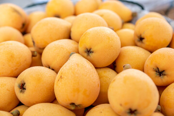 Yellow and big loquats on the plate