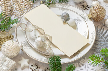 Festive table setting of with fir tree branches and Christmas decorations. Invitation mockup