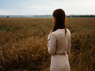 woman in dress in the field nature agriculture freedom