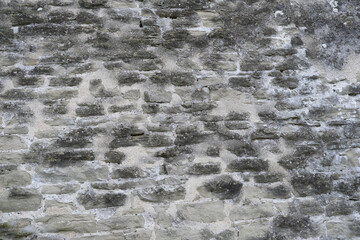 beautiful vintage texture of the wall of a medieval castle built in the middle of the 14th century, multi-colored volumetric stones for the designer, wallpaper, background