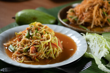 Papaya Salad with Mango Noodles, a popular Thai street food.