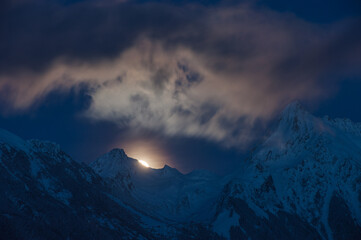Fototapeta na wymiar A night view of the snow-capped Alps in Austria