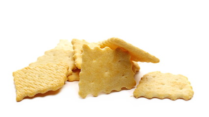 Salty crackers pile isolated on white background
