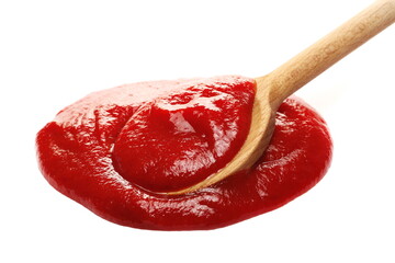 Ketchup red in wooden spoon isolated on white background, tomato pure texture