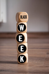 Cubes, dice or blocks with Black friday and black week on wooden background