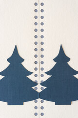 paper christmas trees with a decorative paper background