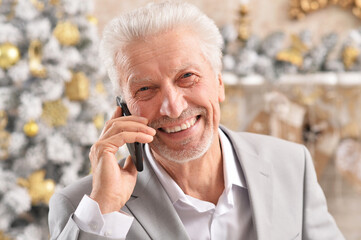 Portrait of senior businessman talking on phone