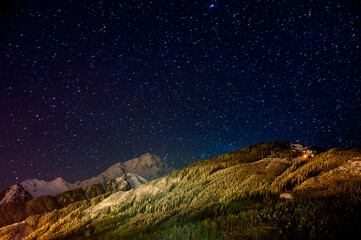 Fototapeta na wymiar A night view of the snow-capped Alps in Austria