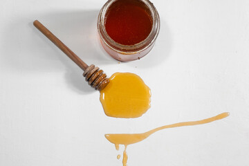 honey spoon on a light background
