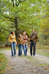 Fototapeta premium Portrait of family of four in park