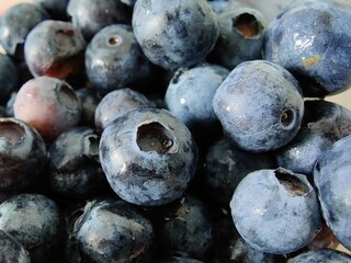 Close up of fresh blueberries -summer berries in a bowl