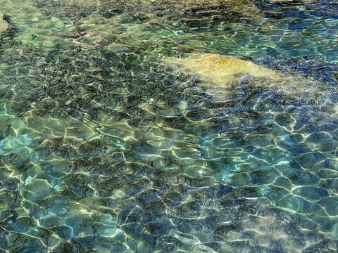 Jade green turquoise sea water surface. Beautiful transparent water of tropical lagoon. Amazing marine seascape. Incredible watercolor background.