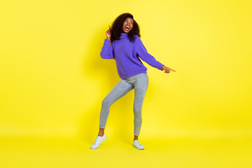 Fototapeta na wymiar Full length portrait of carefree pretty dark skin person look empty space partying isolated on yellow color background