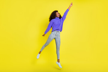 Fototapeta na wymiar Full body portrait of astonished carefree dark skin lady look empty space isolated on yellow color background