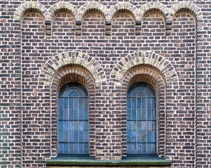 Windows of church on stone wall