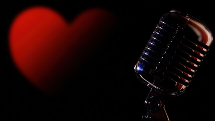 Fototapeta na wymiar A retro vintage shiny microphone on the right of the stage, with room for copyspace, over a big red heart symbol. 