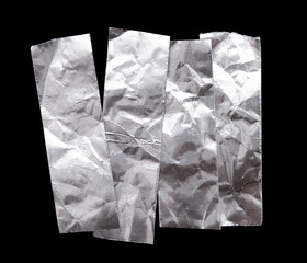 aluminum foil tape shapes cuts isolated on black background for padding or fix leaking tool