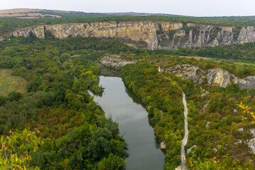 Fototapeta na wymiar Aerial view of Iskar river, passing near village of Karlukovo, Bulgaria. Balkan mountains around.