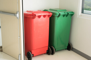 Green and Red infection bin on white floor in the hospital.Infectious control.