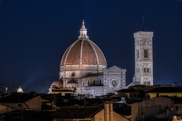 Fototapeta na wymiar Night view of the Duomo and Giotto's bell tower from the rooftops of Florence