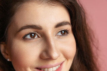 Obraz premium Close-up portrait of young beautiful girl without makeup isolated over pink studio background. Natural beauty concept.