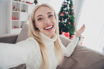 Photo of young attractive woman happy positive smile recording video show demonstrate decoration tree holiday indoors