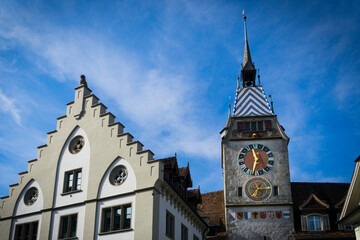 Fototapeta na wymiar Old clock tower from the 15th century, one of the main attractions of the Swiss town of Zug.