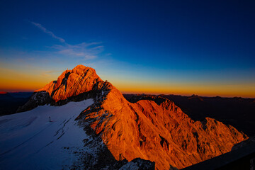 Summer sunset in the Alps at the top of Dachstein 3000 m.