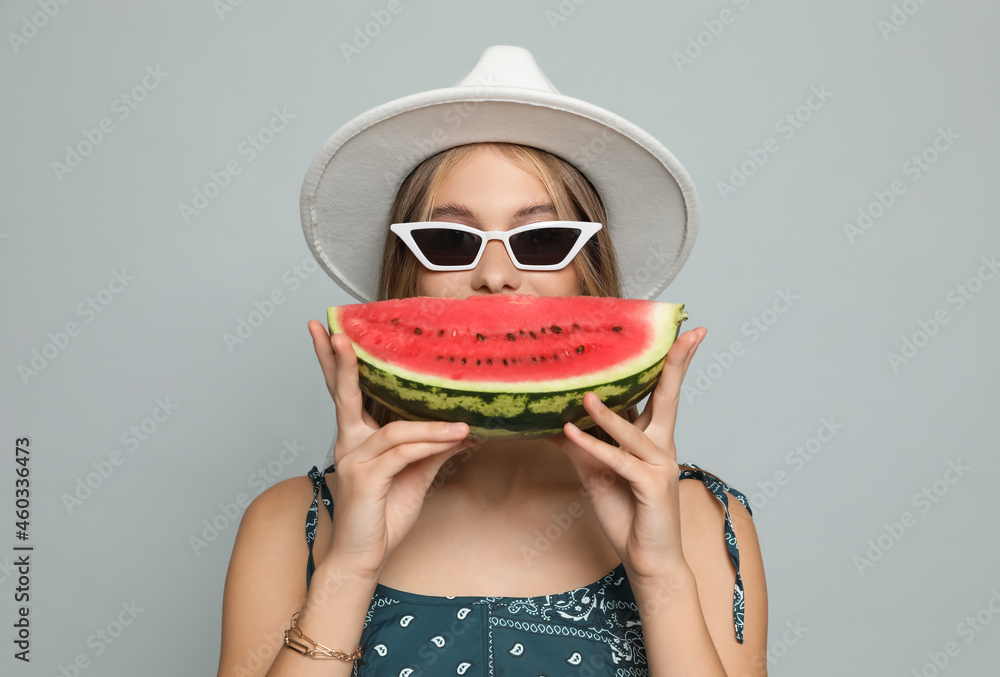 Canvas Prints Beautiful girl with watermelon on grey background