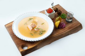 Traditional fish soup soup. in a plate. Isolated on white background.