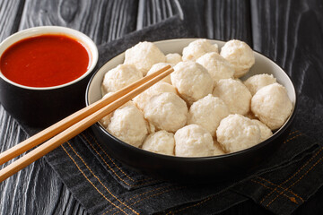 Bakso Indonesian Meatball Best Street Food with sauce close up in the bowl on the table. Horizontal