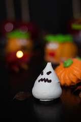 Obraz na płótnie Canvas Bewitching spread of Halloween delights, from cheerful pumpkin figures to ethereal meringue ghosts, creating a perfect holiday ambiance.