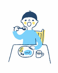 大きな口を開けてご飯を食べる男の子