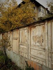old wooden fence, house in autumn